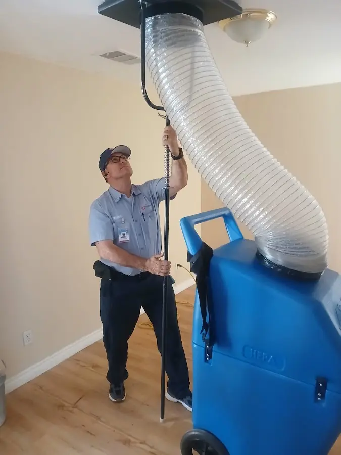 Furnace Tune-Up technician using HEPA equipment in Yucaipa